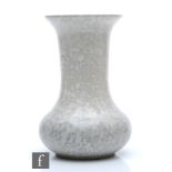 Ruskin Pottery - A high fired vase of globe and shaft form decorated in a grey mottled bubble