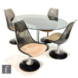 Chromcraft, USA - A smoked glass dining table of oval form raised to a tulip shaped base, together