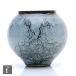 Peter Sparrey - A small contemporary stoneware vase of spherical form decorated in a tonal grey