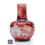 Ruskin Pottery - A high fired vase of globe and shaft form decorated in a sang de beouf glaze with a