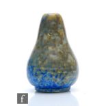 Ruskin Pottery - A miniature vase of pulled form decorated in a mottled green over blue with ochre