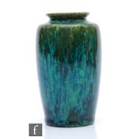 Ruskin Pottery - A small souffle glazed vase of swollen form decorated in a mottled green with tonal