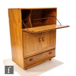 Ercol Furniture - A Windsor model 430 elm serving cabinet or drinks cabinet, with fall-front above