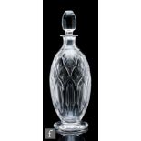 Ludwig Kny - Stuart and Sons - A glass decanter of footed ovoid form, circa 1938, cut with arches in
