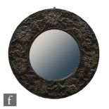 Unknown - An Arts & Crafts pewter convex wall mirror, the central domed mirror plate encircled