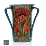 William Moorcroft - James Macintyre & Co - A large three handled tyg vase decorated in the Revived