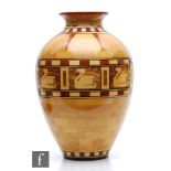 Bill Robinson - A contemporary segmented woodturned vase of ovoid form with flared rim, decorated