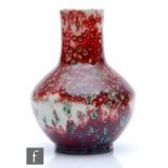 Ruskin Pottery - A high fired vase of angular globe and shaft form decorated in a sang de beouf with