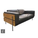 Robin Day - Habitat - A Forum two seat sofa, upholstered in dark chocolate coloured leather, the