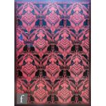 Biba - A framed piece of original Biba wrapping paper in red on black with a repeat logo design,