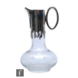 Mappin & Webb - A hallmarked silver and clear crystal claret jug, of squat ovoid form with tall