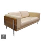 Robin Day - Habitat - A Forum two seat sofa, upholstered in cream coloured leather, the frame with