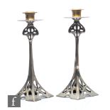 Unknown - A pair of Arts & Crafts style silver plated candlesticks, each of the flared square