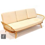 Lucian Ercolani for Ercol Furniture - A model 355 studio couch or sofa, with solid elm panel back