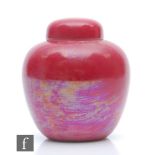 Ruskin Pottery - A small jar and cover or caddy decorated in a Strawberry Crush pink lustre,