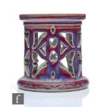 Ruskin Pottery - A small high fired cylindrical stand with pierced decoration, the whole glazed in