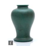 Ruskin Pottery - A vase of inverted baluster form decorated in a moss green glaze, impressed mark