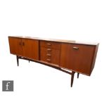 G-Plan Furniture - A teak sideboard, model number 4058, fitted with an arrangement of four central