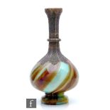 Loetz - A late 19th Century Onyx glass vase, circa 1887, of footed globe and shaft form with a
