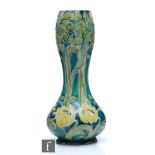 William Moorcroft - An early 20th Century vase of slender gourd form decorated in the Tulip