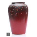 Scheurich - A post war West German vase of compressed oval form decorated in a tonal pink glaze with