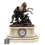 A 19th Century French spelter mantle clock modelled as a prancing horse being reined in by a