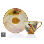An early 20th Century Royal Worcester cabinet coffee cup and saucer decorated by Austin and Shuck,