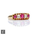 A 19th Century 18ct ruby and diamond five stone boat shaped ring, claw set stones to plain