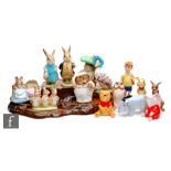 A collection of assorted Beswick Beatrix Potter and Winnie the Pooh figures comprising seven Beatrix