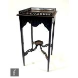 An Edwardian Chippendale style square gallery top jardinere stand, fret carved frieze, on slender