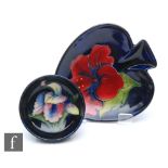 Two pieces of Moorcroft comprising a small footed bowl decorated in the Frilled Orchid pattern,