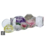 A collection of 20th Century paperweights to include cased, lampworked and cut and polished examples