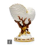 A late 19th Century Royal Worcester spoon warmer or posy vase modelled as a nautilus shell, raised