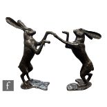 A pair of contemporary bronze figures of boxing hares, bearing spurious signature after Mene,