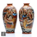 A pair of Meiji/Taisho period Japanese vases, each of rounded form terminating at an everted rim,