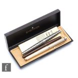 A late 20th Century Sheaffer sterling silver fountain pen with ribbed barrel and conforming cap, the