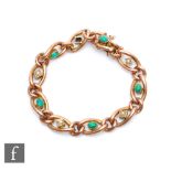 An early 20th Century 9ct rose gold open curb link bracelet, weight 13g, detailed with alternating