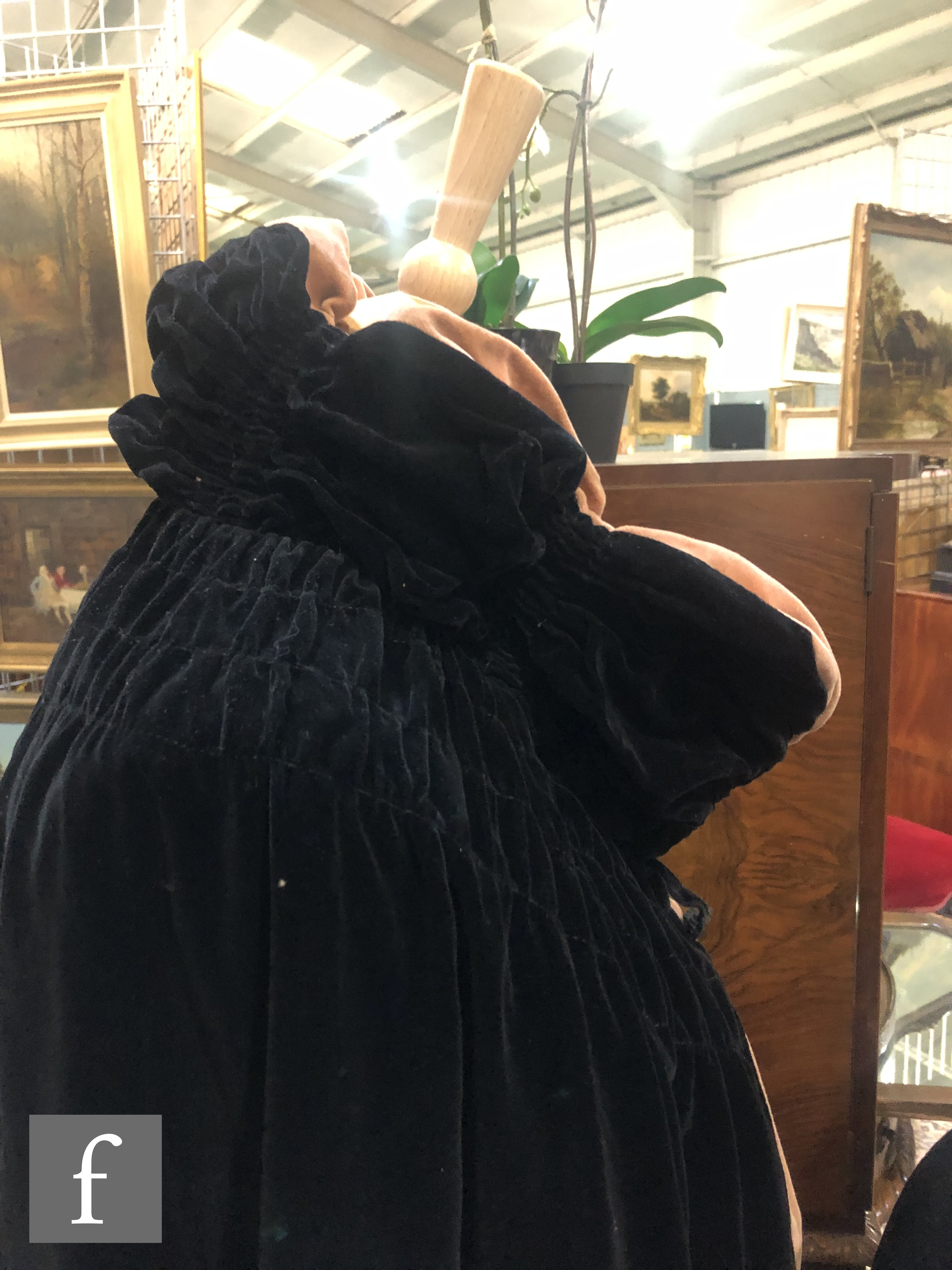A 1920s reversible opera cape in black velvet with salmon pink lining and ruched padded collar. - Image 2 of 5