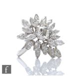 A mid 20th Century 18ct white gold diamond cluster ring, central brilliant cut stone weight
