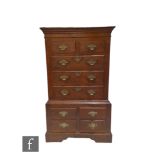 A small George III style oak chest on chest fitted with two short and four long drawers over a
