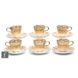 A set of six 19th Century teacups and saucers, probably Ridgeway, each decorated with a gilt