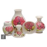 Five pieces of Moorcroft comprising a baluster vase, a small ginger jar and cover, a footed bowl,