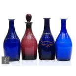 A small collection of late 18th Century decanter bottles each of skittle form, three in Bristol Blue