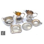 Two George III cream jugs, marks rubbed, a sugar basin, an engine turned ash tray, a small