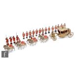 A Britains Coronation Coach set 9401 comprising gilt coach with seated figure of the Queen and the