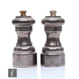 A hallmarked silver salt and pepper grinder of plain waisted form, height 11cm, London 1979/80,
