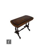 A Victorian inlaid walnut and ebonised banded centre table on twin pillar supports and splayed legs,