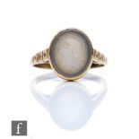 A 9ct single hard stone ring, oval stone with intaglio carved profile of a Roman soldier, weight 4g,