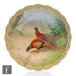 An early 20th Century Minton cabinet plate decorated by J. E Dean with two hand painted pheasants