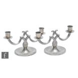 A pair of 1930s Swedish pewter two light candelabra by GAB, with circular base, stamped marks,